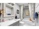 Bathroom with a marble vanity, luxurious soaking tub, and stylish gray color scheme at 4771 Pinefield Nw Dr, Acworth, GA 30102