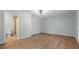 Spacious bedroom with wood flooring, neutral walls, and an ensuite bathroom at 4771 Pinefield Nw Dr, Acworth, GA 30102
