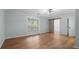 Light and airy bedroom featuring a barn door closet and a large window at 4771 Pinefield Nw Dr, Acworth, GA 30102