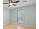 This bedroom has a ceiling fan, white trim and a double window that provides natural light at 4771 Pinefield Nw Dr, Acworth, GA 30102