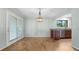 Bright dining area with a modern light fixture and access to a patio at 4771 Pinefield Nw Dr, Acworth, GA 30102
