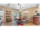 Cozy dining area featuring hardwood floors, a stylish chandelier, and ample space for Gathering gatherings at 4771 Pinefield Nw Dr, Acworth, GA 30102