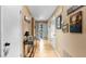 Bright hallway featuring neutral decor, tile flooring, and stylish console table, leading to the rest of the home at 4771 Pinefield Nw Dr, Acworth, GA 30102