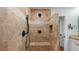 Luxurious tiled shower with a rainfall showerhead, handheld sprayer, and built-in bench at 4771 Pinefield Nw Dr, Acworth, GA 30102