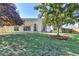 A well-manicured backyard with lush green grass and mature trees offers a serene outdoor space at 1550 Misty Valley Dr, Lawrenceville, GA 30045