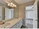 Bathroom featuring a double vanity with good lighting and a large mirror at 1550 Misty Valley Dr, Lawrenceville, GA 30045