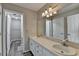Bathroom featuring a double vanity with good lighting and a large mirror at 1550 Misty Valley Dr, Lawrenceville, GA 30045