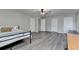 Spacious bedroom with gray floors and a ceiling fan offers ample space and comfort at 1550 Misty Valley Dr, Lawrenceville, GA 30045