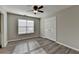 Bedroom boasts natural light with a ceiling fan and hardwood floors at 1550 Misty Valley Dr, Lawrenceville, GA 30045