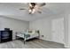 Bedroom features a ceiling fan, hardwood floors, and neutral paint at 1550 Misty Valley Dr, Lawrenceville, GA 30045