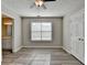 Bedroom featuring hardwood floors, neutral paint and light from a window at 1550 Misty Valley Dr, Lawrenceville, GA 30045