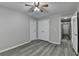 Bedroom features hardwood floors, neutral paint, and a ceiling fan at 1550 Misty Valley Dr, Lawrenceville, GA 30045