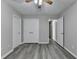 Bedroom features hardwood floors, neutral paint, and a ceiling fan at 1550 Misty Valley Dr, Lawrenceville, GA 30045