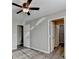 Bright bedroom has hardwood floors, neutral paint, and a ceiling fan at 1550 Misty Valley Dr, Lawrenceville, GA 30045