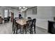 Cozy dining room with a modern chandelier, wood floors, and adjacent staircase at 1550 Misty Valley Dr, Lawrenceville, GA 30045