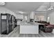 Modern kitchen with stainless steel appliances, granite countertops, and island with seating at 1550 Misty Valley Dr, Lawrenceville, GA 30045