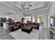Spacious living room with tray ceilings, wood floors, and an open layout to the kitchen at 1550 Misty Valley Dr, Lawrenceville, GA 30045