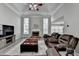 Inviting living room with a fireplace, large windows, and comfortable seating area at 1550 Misty Valley Dr, Lawrenceville, GA 30045