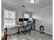 Bright office space with sleek floors, neutral walls, and a large window for natural light at 1550 Misty Valley Dr, Lawrenceville, GA 30045