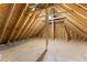 Unfinished attic space with wooden beams and rafters, providing ample potential for storage or expansion at 216 Creek View Pl, Canton, GA 30114