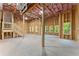 Spacious unfinished basement with large windows providing natural light and a walkout entrance at 216 Creek View Pl, Canton, GA 30114