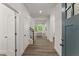 Bright entryway with hardwood floors, leading into a spacious living area with natural light at 216 Creek View Pl, Canton, GA 30114