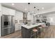 Modern kitchen with a large island, stainless appliances, and an open design at 216 Creek View Pl, Canton, GA 30114