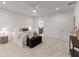 Spacious main bedroom with plush carpeting, ceiling fan, and lots of natural light at 216 Creek View Pl, Canton, GA 30114