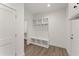 Convenient mudroom with built-in storage, hooks, and bench for easy organization at 216 Creek View Pl, Canton, GA 30114