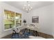 Stylish home office with large window, modern light fixture, and view of the yard at 216 Creek View Pl, Canton, GA 30114