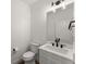 Elegant powder room with modern fixtures, vanity, and stylish mirror at 216 Creek View Pl, Canton, GA 30114