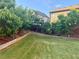 Spacious backyard with lush green lawn and trees along the fence line at 3670 Kissell Dr, Cumming, GA 30041
