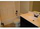 Modern bathroom featuring a shower and tub combination and a dark wood vanity at 3670 Kissell Dr, Cumming, GA 30041