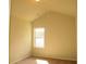 A quiet bedroom with high ceilings and a large window for natural light at 3670 Kissell Dr, Cumming, GA 30041