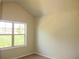 A quiet bedroom with high ceilings and a large window for natural light at 3670 Kissell Dr, Cumming, GA 30041