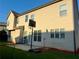 Back of a two story home with lots of windows and patio space with basketball hoop at 3670 Kissell Dr, Cumming, GA 30041