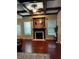 Relax in the spacious living room with coffered ceilings and traditional fireplace feature at 3670 Kissell Dr, Cumming, GA 30041