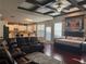 Open-concept living area features hardwood floors, coffered ceilings, and stylish decor at 3670 Kissell Dr, Cumming, GA 30041