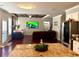 Open-concept living space with hardwood floors, stainless steel appliances, and stylish decor at 3670 Kissell Dr, Cumming, GA 30041