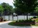 Community tennis court surrounded by a secure fence and lush landscaping for recreational enjoyment at 3670 Kissell Dr, Cumming, GA 30041