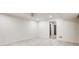 Spacious basement area with tile flooring, white walls, and a ceiling fan at 3916 Green Forest Se Ln, Smyrna, GA 30082