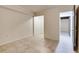 Basement room with tiled floors, white walls, and two doorways at 3916 Green Forest Se Ln, Smyrna, GA 30082