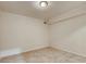 Empty basement area with tile flooring, white walls, and a ceiling light at 3916 Green Forest Se Ln, Smyrna, GA 30082