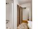 Bathroom featuring tiled floor, shower and a door leading to another area at 3916 Green Forest Se Ln, Smyrna, GA 30082