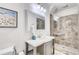 Elegant bathroom featuring a glass enclosed shower, modern vanity, and stylish tile work at 3916 Green Forest Se Ln, Smyrna, GA 30082