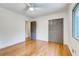 Spacious bedroom with hardwood floors, ample closet space, and a ceiling fan for added comfort at 3916 Green Forest Se Ln, Smyrna, GA 30082