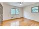 Sunlit bedroom boasts hardwood floors and natural light, creating a warm and inviting atmosphere at 3916 Green Forest Se Ln, Smyrna, GA 30082