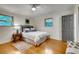 Bright bedroom showcases hardwood floors, complemented by natural light and a ceiling fan at 3916 Green Forest Se Ln, Smyrna, GA 30082