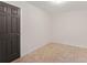Neutral bedroom offers tile flooring, a closet and a door for privacy at 3916 Green Forest Se Ln, Smyrna, GA 30082