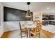Inviting dining area featuring a modern light fixture and a unique chalkboard wall for personalized creativity at 3916 Green Forest Se Ln, Smyrna, GA 30082
